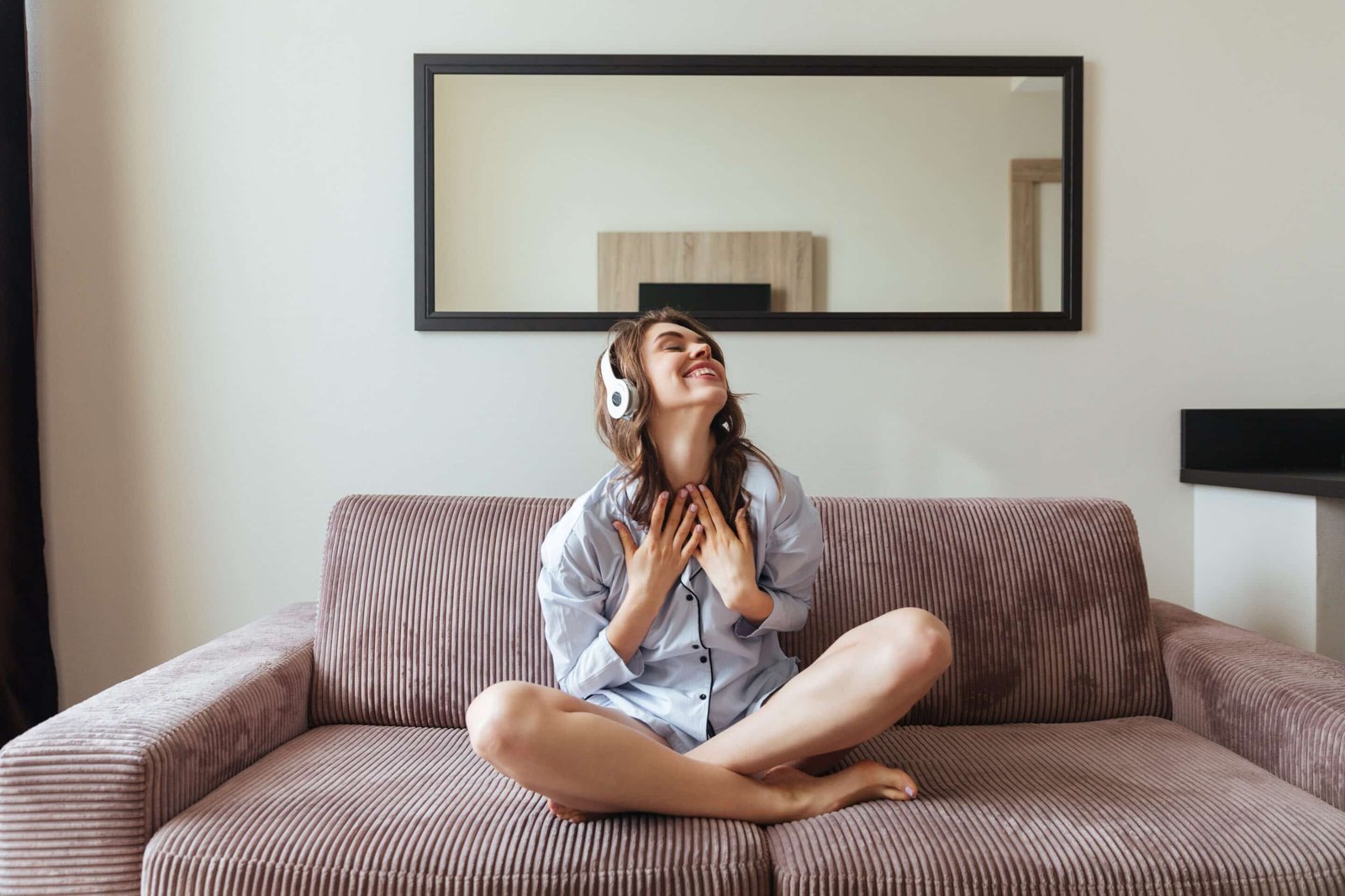 happy young lady sitting at home listening music happy young lady sitting at home listening music